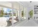 Relaxing bedroom with sliding glass doors leading to a patio and pool area, offering stunning views at 5910 Gulf Of Mexico Dr, Longboat Key, FL 34228
