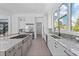 Bright kitchen with stainless steel appliances, granite counters, and plenty of storage at 5910 Gulf Of Mexico Dr, Longboat Key, FL 34228