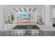 Gourmet kitchen showcasing high-end appliances, a large island, and an open-concept design to the living space at 5910 Gulf Of Mexico Dr, Longboat Key, FL 34228