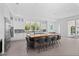 Modern kitchen with a large island, stainless steel appliances, and stylish bar stool seating at 5910 Gulf Of Mexico Dr, Longboat Key, FL 34228