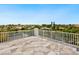 Rooftop deck with marble floor, white railing, and a panoramic view at 5910 Gulf Of Mexico Dr, Longboat Key, FL 34228