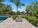 Relaxing fire pit area overlooking the canal at 5910 Gulf Of Mexico Dr, Longboat Key, FL 34228