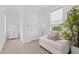 Cozy sitting area with a comfortable chair and natural light at 5910 Gulf Of Mexico Dr, Longboat Key, FL 34228