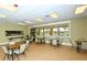 The meeting room is open and spacious, featuring tables, chairs, and a serving area for community gatherings at 6771 Wild Lake Ter, Bradenton, FL 34212