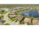 Two-story house next to a lake in a residential community at 6771 Wild Lake Ter, Bradenton, FL 34212