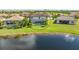 Aerial view of home with pool and backyard, near lake at 6771 Wild Lake Ter, Bradenton, FL 34212