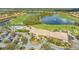 Aerial view of community clubhouse with pool and parking at 6771 Wild Lake Ter, Bradenton, FL 34212
