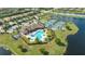 Aerial view of community with pool, tennis, and clubhouse at 6771 Wild Lake Ter, Bradenton, FL 34212