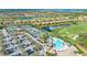Aerial view of community amenities, including tennis courts and pool at 6771 Wild Lake Ter, Bradenton, FL 34212
