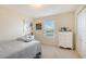 Bright bedroom with a dresser and window at 6771 Wild Lake Ter, Bradenton, FL 34212