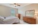 Bedroom with dresser and mirror at 6771 Wild Lake Ter, Bradenton, FL 34212