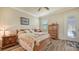 Cozy bedroom with wooden furniture and access to a patio at 6771 Wild Lake Ter, Bradenton, FL 34212