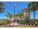 Community clubhouse with landscaping and flag at 6771 Wild Lake Ter, Bradenton, FL 34212