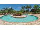 Circular community pool with surrounding lounge chairs at 6771 Wild Lake Ter, Bradenton, FL 34212