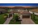 Two-story home with a tile roof, two-car garage, and landscaped yard at 6771 Wild Lake Ter, Bradenton, FL 34212