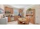 Charming kitchen with wood cabinetry and a built-in hutch at 6771 Wild Lake Ter, Bradenton, FL 34212