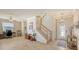 Bright and spacious living room with a view of the staircase and office at 6771 Wild Lake Ter, Bradenton, FL 34212