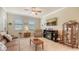Spacious living room with comfortable seating and a fireplace at 6771 Wild Lake Ter, Bradenton, FL 34212