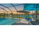 Screened pool area with patio furniture at 6771 Wild Lake Ter, Bradenton, FL 34212