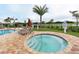 Relaxing spa tub surrounded by lounge chairs at 6771 Wild Lake Ter, Bradenton, FL 34212