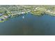 Aerial view showing home's location on a lake in a residential neighborhood at 7407 Sea Island Ln, Bradenton, FL 34201