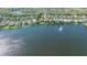 Aerial view of a waterfront home in a community with lush landscaping at 7407 Sea Island Ln, Bradenton, FL 34201