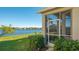 A scenic backyard with a lake view, lush lawn, and well-maintained landscaping, creating an outdoor oasis at 7407 Sea Island Ln, Bradenton, FL 34201