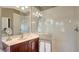 This bathroom features a glass enclosed shower, vanity with a sink, and a heated towel rack at 7407 Sea Island Ln, Bradenton, FL 34201