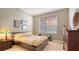 This bedroom is nicely lit with a neutral color scheme and minimalistic decorations at 7407 Sea Island Ln, Bradenton, FL 34201