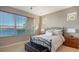 This bedroom offers a comfortable retreat with scenic water views from the large window at 7407 Sea Island Ln, Bradenton, FL 34201