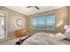 This bedroom has great natural light and soothing views of the lake beyond at 7407 Sea Island Ln, Bradenton, FL 34201