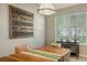 Dining space with natural light, blinds, and an adjacent wooden console table at 7407 Sea Island Ln, Bradenton, FL 34201
