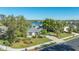 Single-story home exterior, featuring a landscaped yard and lake view at 7407 Sea Island Ln, Bradenton, FL 34201