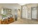 Welcoming foyer showcasing tile flooring, elegant decor, and bright natural light at 7407 Sea Island Ln, Bradenton, FL 34201