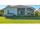 One-story house with screened lanai and landscaped yard at 7407 Sea Island Ln, Bradenton, FL 34201