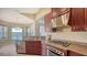 Well-equipped kitchen with granite counters, stainless appliances, and bright natural light at 7407 Sea Island Ln, Bradenton, FL 34201