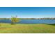Expansive lake view provides a serene backdrop for this home's outdoor living space at 7407 Sea Island Ln, Bradenton, FL 34201