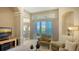 Living room with lake view, featuring comfortable seating and a neutral color scheme at 7407 Sea Island Ln, Bradenton, FL 34201