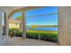 An outdoor patio offers stunning views of the lake, creating a serene and relaxing atmosphere at 7407 Sea Island Ln, Bradenton, FL 34201