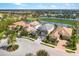 Aerial view of a luxury home community with a lake at 7634 Windy Hill Cv, Bradenton, FL 34202