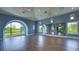 Spacious yoga studio with hardwood floors and large windows at 8124 Anthirium Loop, Sarasota, FL 34240
