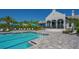 Community pool with a relaxing atmosphere and lounge chairs at 8124 Anthirium Loop, Sarasota, FL 34240