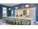 Modern clubhouse kitchen with bar seating and appliances at 8124 Anthirium Loop, Sarasota, FL 34240
