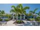 Community clubhouse with palm trees and seating at 8124 Anthirium Loop, Sarasota, FL 34240