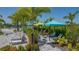 Pool area with lounge chairs and shade umbrellas at 8124 Anthirium Loop, Sarasota, FL 34240