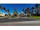 Community entrance with palm trees and landscaping at 99 Vivante Blvd # 99315, Punta Gorda, FL 33950