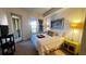 Bright bedroom with king bed and access to balcony at 99 Vivante Blvd # 99315, Punta Gorda, FL 33950