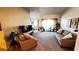 Spacious living room featuring comfortable sofas and access to a balcony at 99 Vivante Blvd # 99315, Punta Gorda, FL 33950