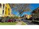 Community view with yellow buildings and lush landscaping at 99 Vivante Blvd # 99315, Punta Gorda, FL 33950
