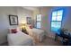 Bright bedroom with two twin beds, nightstand and large window at 99 Vivante Blvd # 99315, Punta Gorda, FL 33950